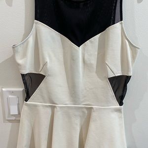 White top with black sheer paneling
